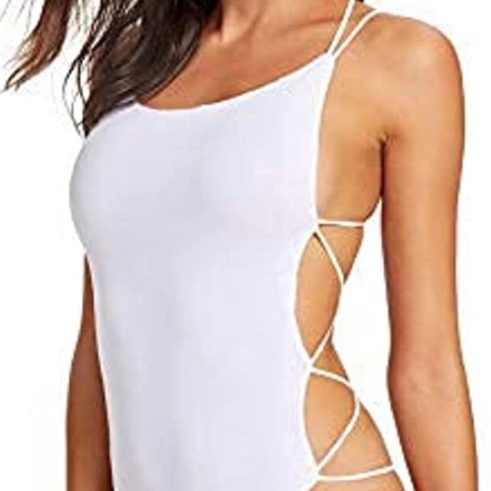 White bodysuit WORN ONCE to a concert. Sexy strappy backs and awesome fit!!
